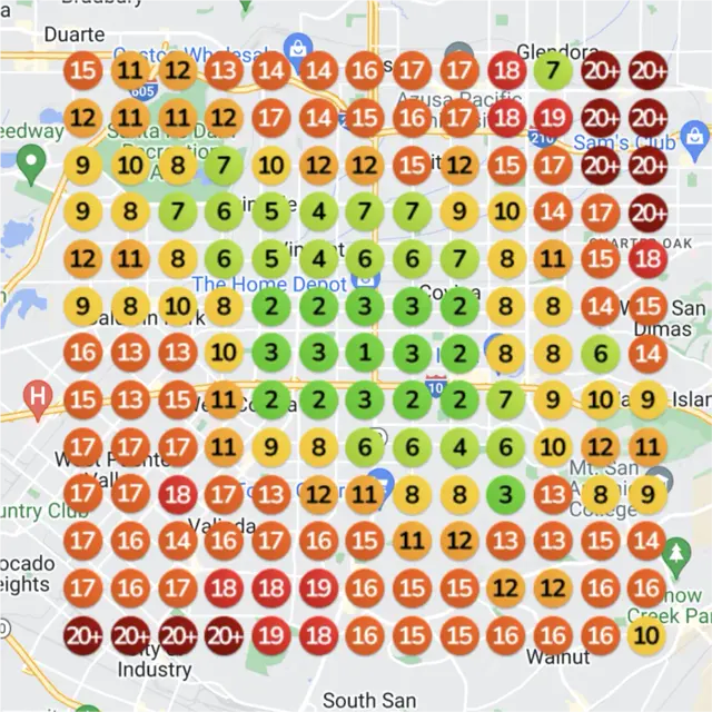 Ranking map for a spa, before: a grid of numbered dots over a town map, each showing where the business came up on Google Maps for "hot stone massage" from that spot